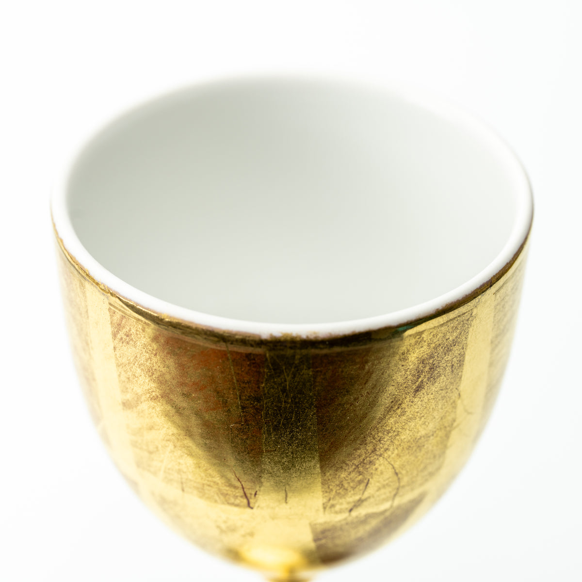 Top view of the gold leaf wine cup's pale interior and thin rim.