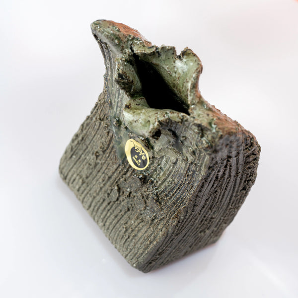 Angled top view of a Shigaraki ware bud vase with textured surface