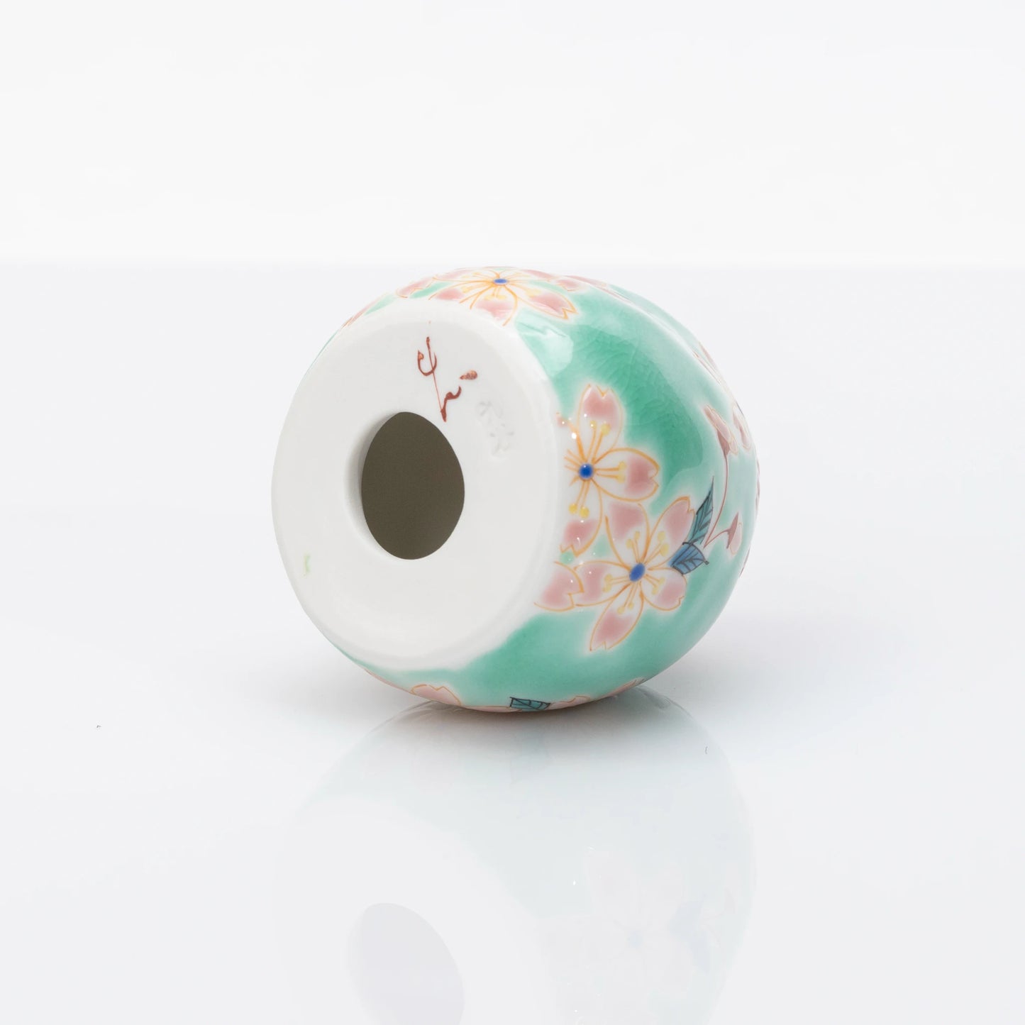 Underside detail of aqua cherry blossom Kutani Daruma