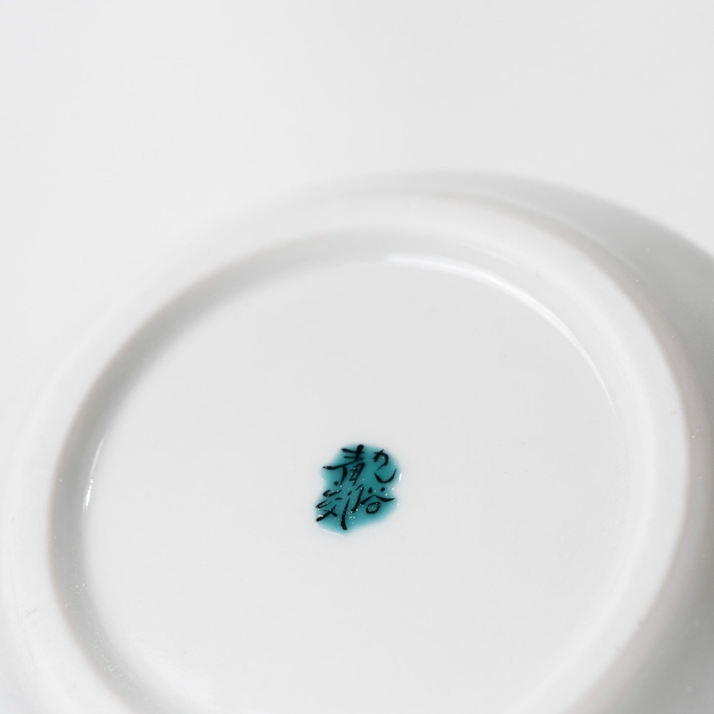 Close-up of stainless steel strainer and teapot opening
