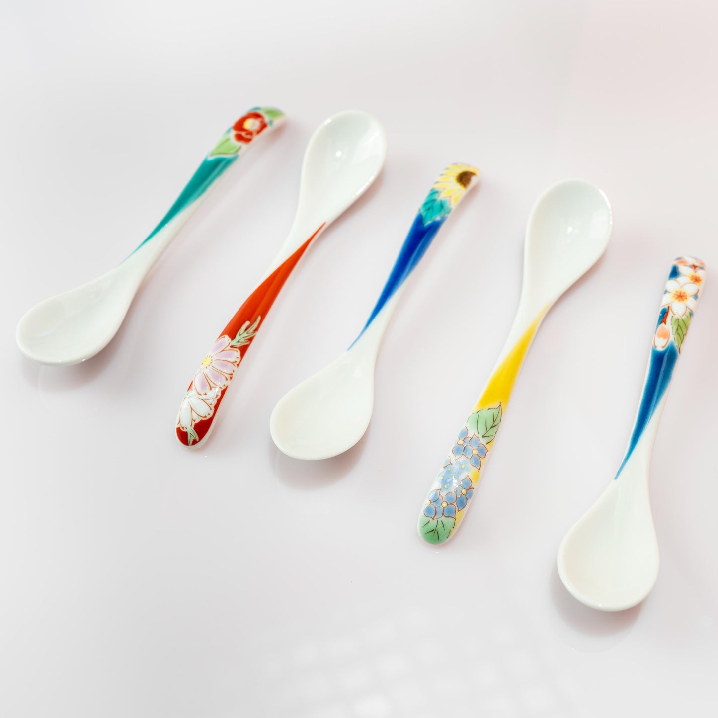Assorted Kutani floral spoons displayed together