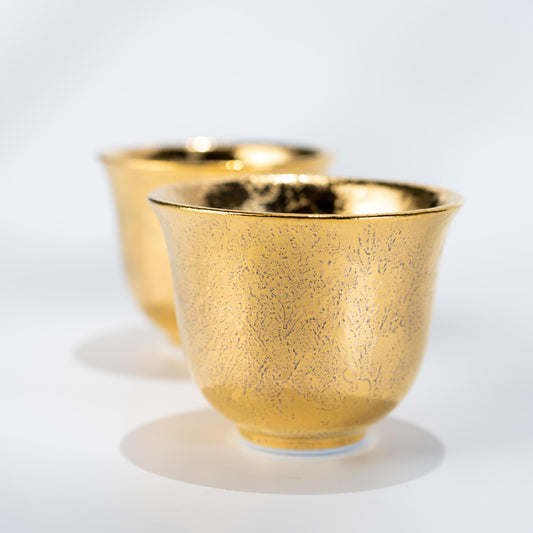 Front view of gold glazed Arita teapot and cups set