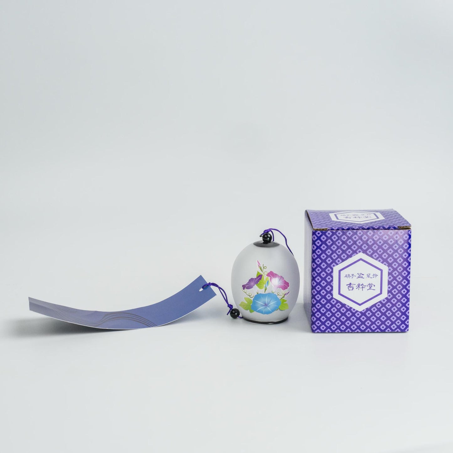 The glass wind chime with its original printed gift box