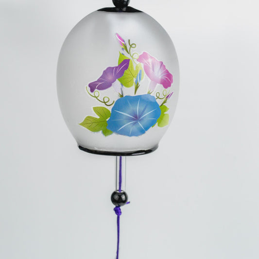 Morning glory asagao glass wind chime hanging, showing the purple braided cord and black accent beads