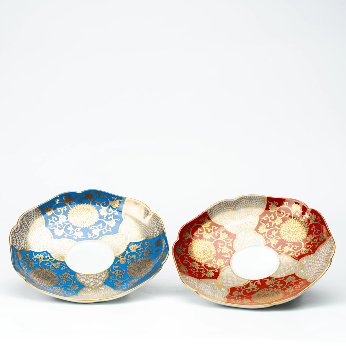 Blue and red gold-patterned saucers shown side by side for comparison.
