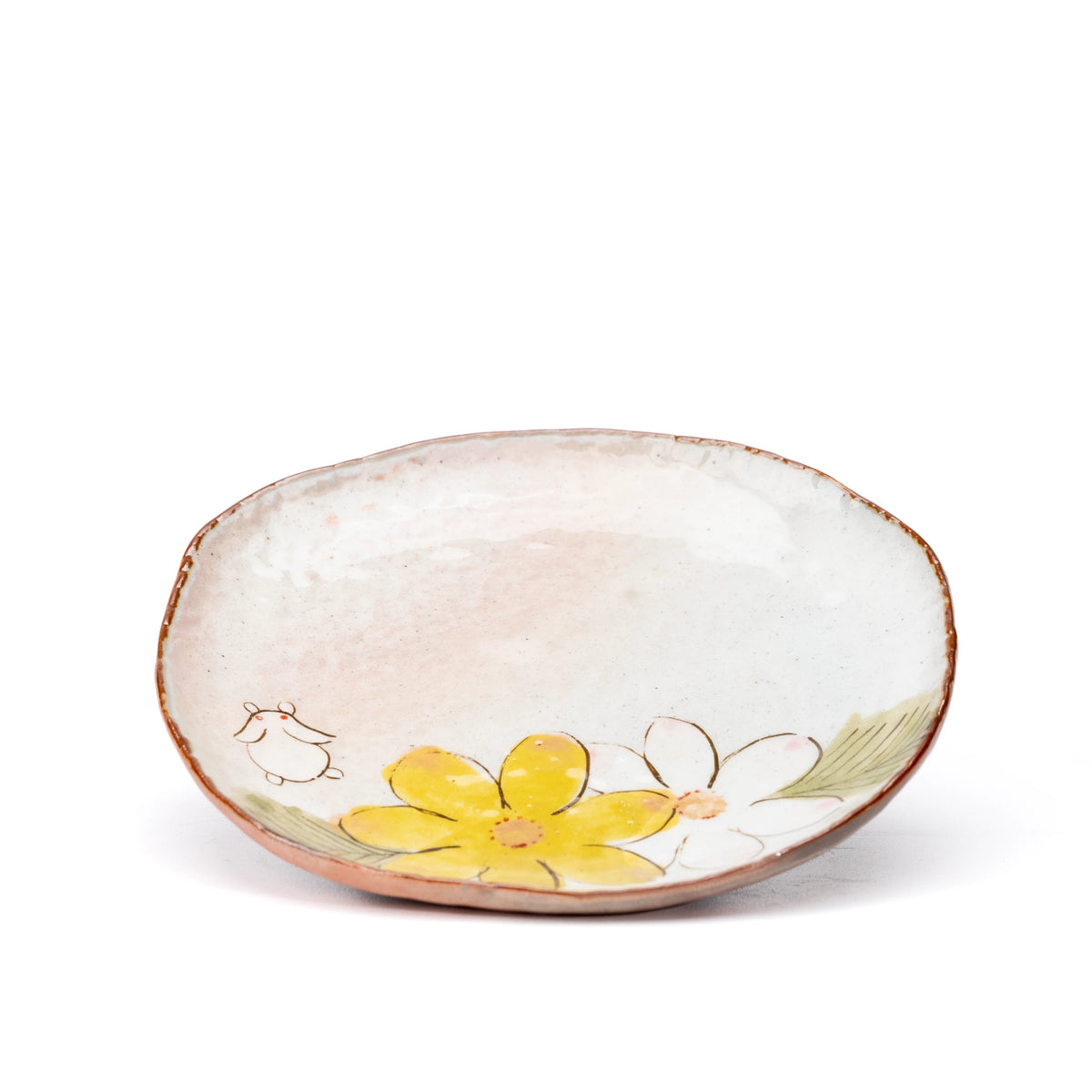 Yellow floral and white rabbit decoration on the matching saucer.