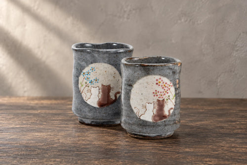 mugs cups โ selected objects on a wooden studio table.