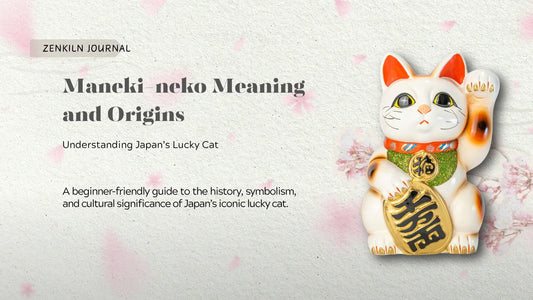 ZenKiln Journal graphic titled “Maneki-neko Meaning and Origins: Understanding Japan’s Lucky Cat,” featuring a white maneki-neko figurine with a raised paw, gold coin, and cherry blossoms.