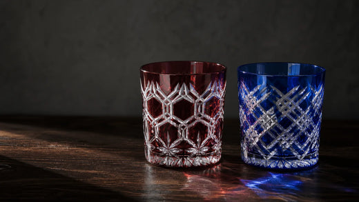 Equal-size red and blue Edo Kiriko tumblers with sharp kagome and yarai cut patterns