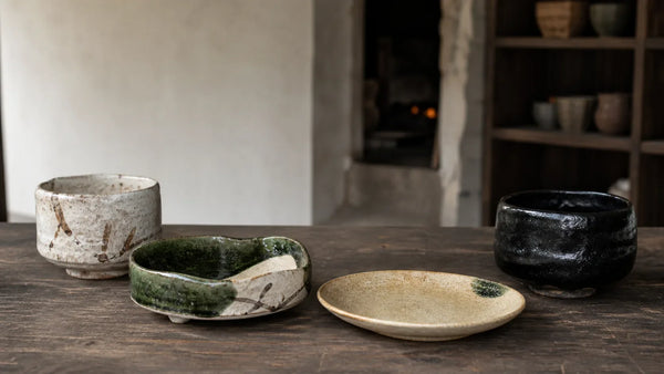 Shino, Oribe, Ki-Seto, and Setoguro vessels arranged in a Gifu pottery studio