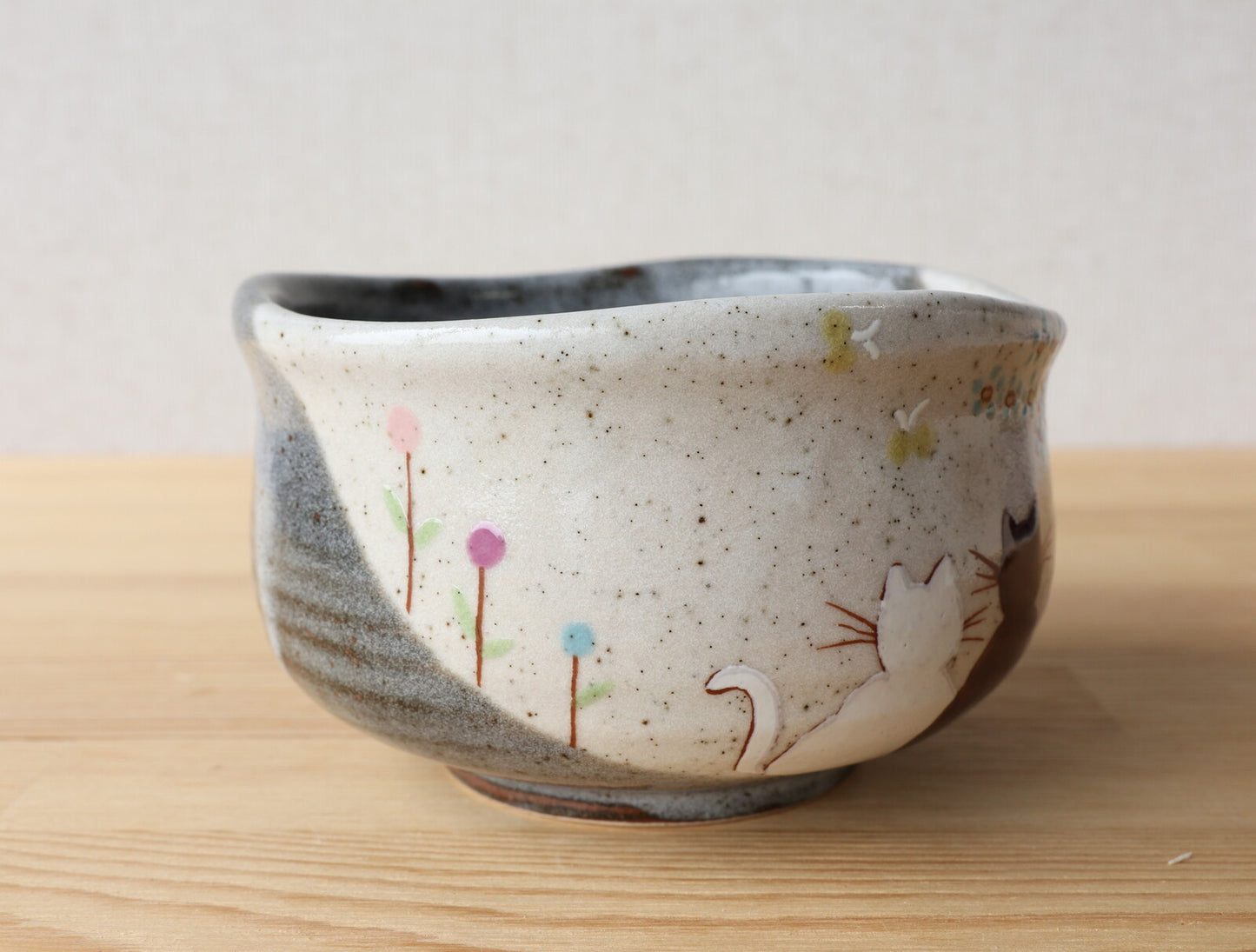 Front view of Kutani Hidamari Japanese chawan on tabletop
