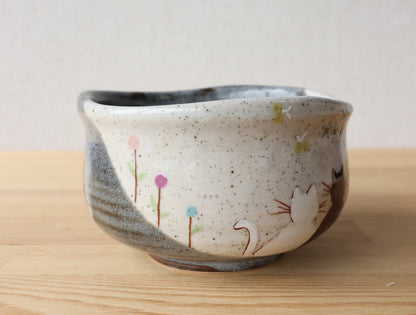 Front view of Kutani Hidamari Japanese chawan on tabletop