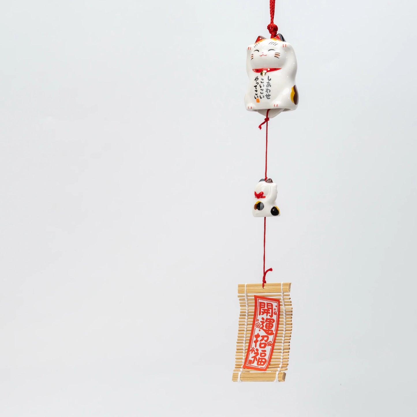 Calico maneki neko ceramic wind chime, parent cat, kitten and slatted wind catcher on one red cord
