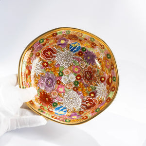Top view of Kutani Kinhanazume bowl showing full floral interior pattern