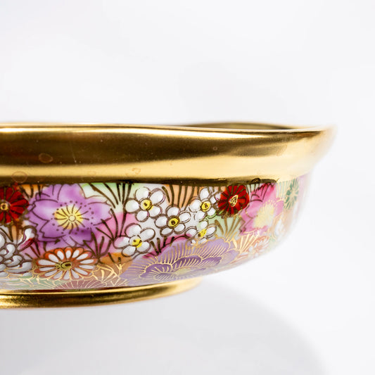 Side close-up of Kutani gold floral serving bowl showing rim and wall detail
