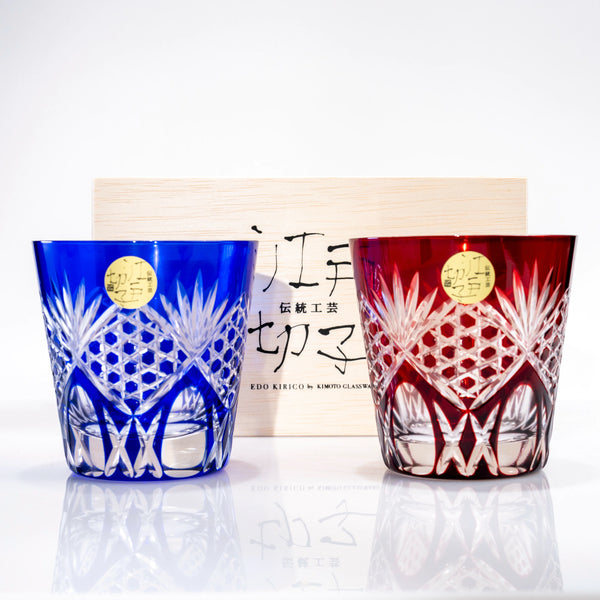 Set of two Edo Kiriko whiskey tumblers in red and blue with hexagonal cut pattern and wooden gift box