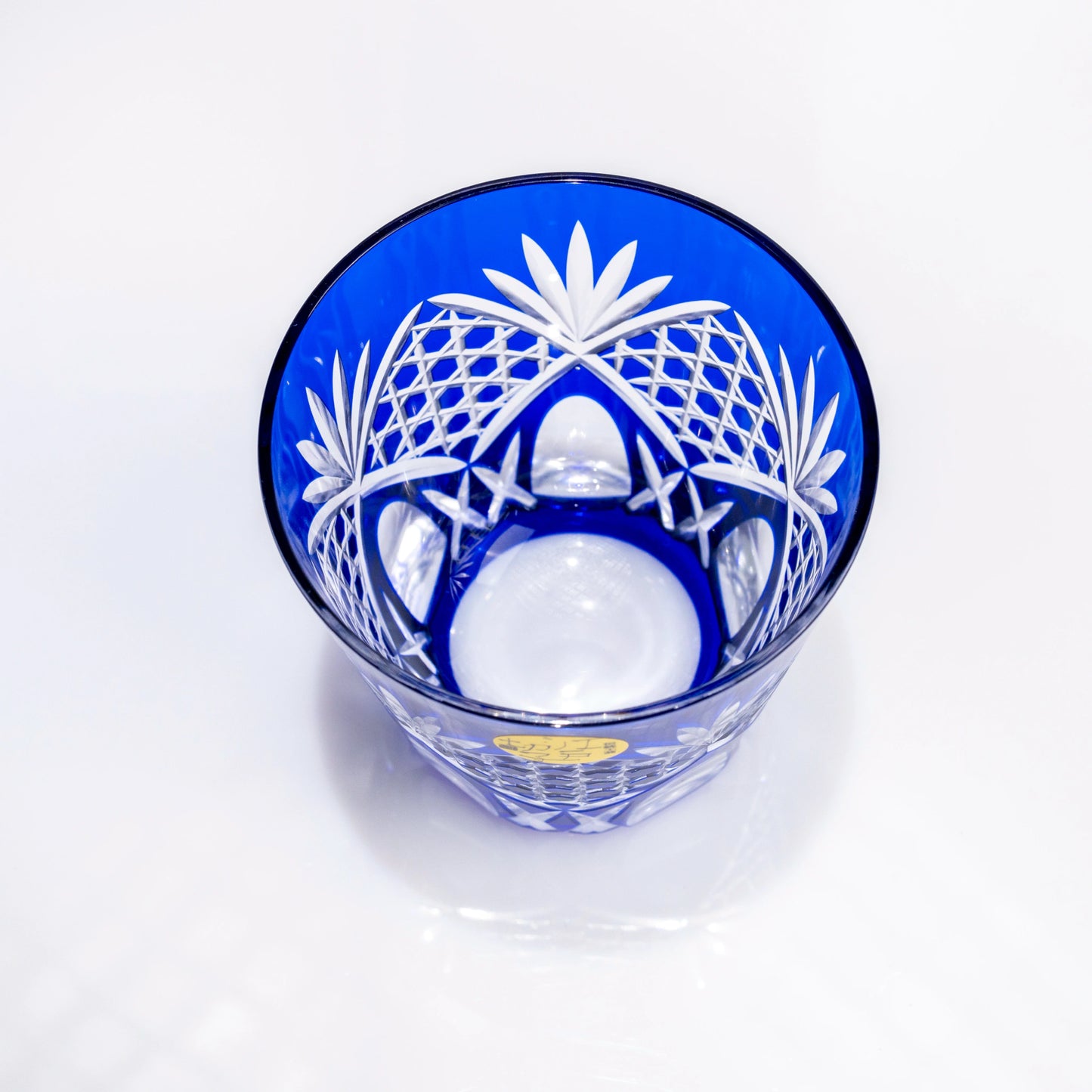 Top view of a blue Edo Kiriko whiskey tumbler showing the cut-glass interior