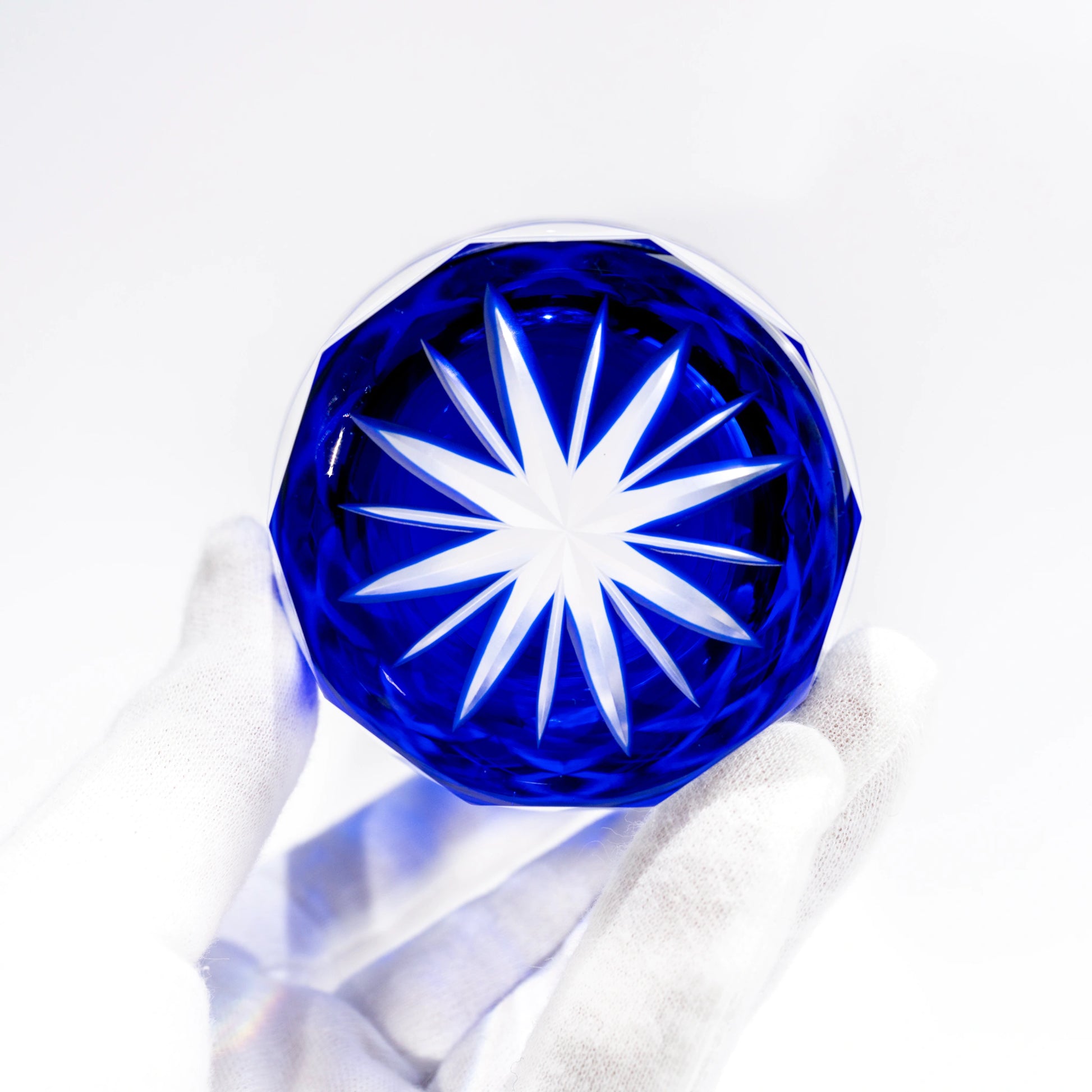 Base view of blue Edo Kiriko tumbler showing star cut underside