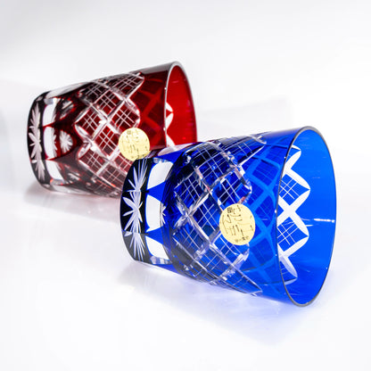 Red and blue Edo Kiriko tumblers laid on their sides, side angle view