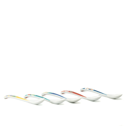 Low side view of five Kutani tea spoons showing the curved handles and shallow bowls.