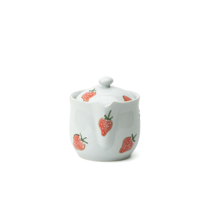 Front view of the strawberry teapot showing its short spout and strawberry-decorated lid.