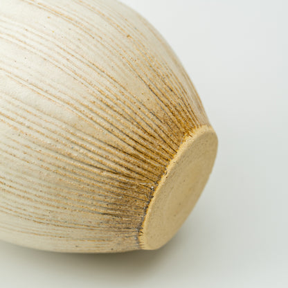 Detail of the Kairo vase's flat unglazed base and fine ridges radiating up the body.