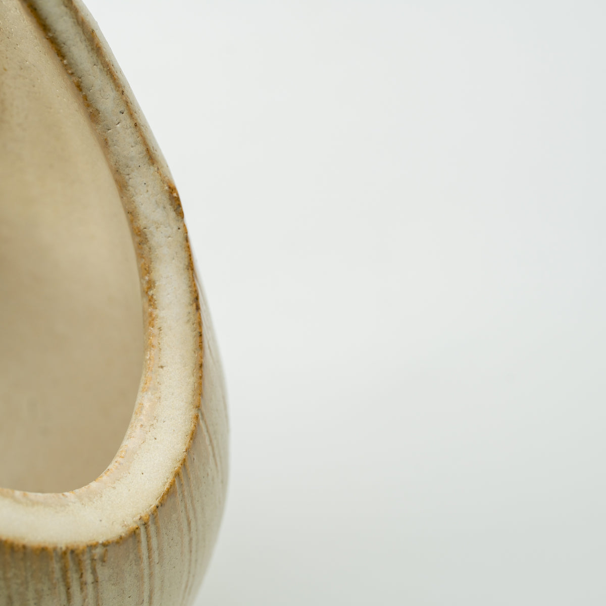 Close-up of the thick curved edge around the Kairo vase's large loop opening.