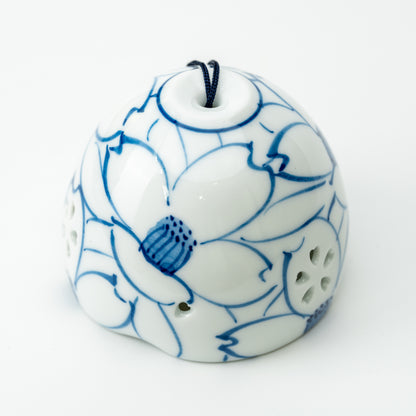 Front detail of the white Arita wind-chime bell with large blue-outlined camellias.