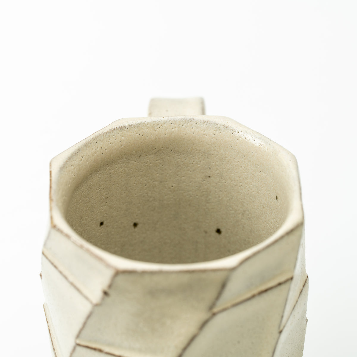 Overhead view of the Greige mug showing its angular rim and beige interior.