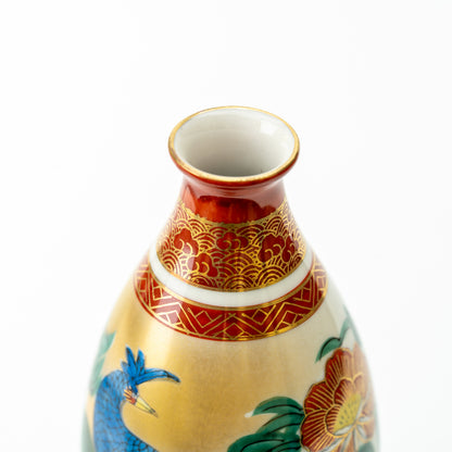 Close-up of the Kutani sake bottle's open mouth and red neck with fine gold-colored patterns.