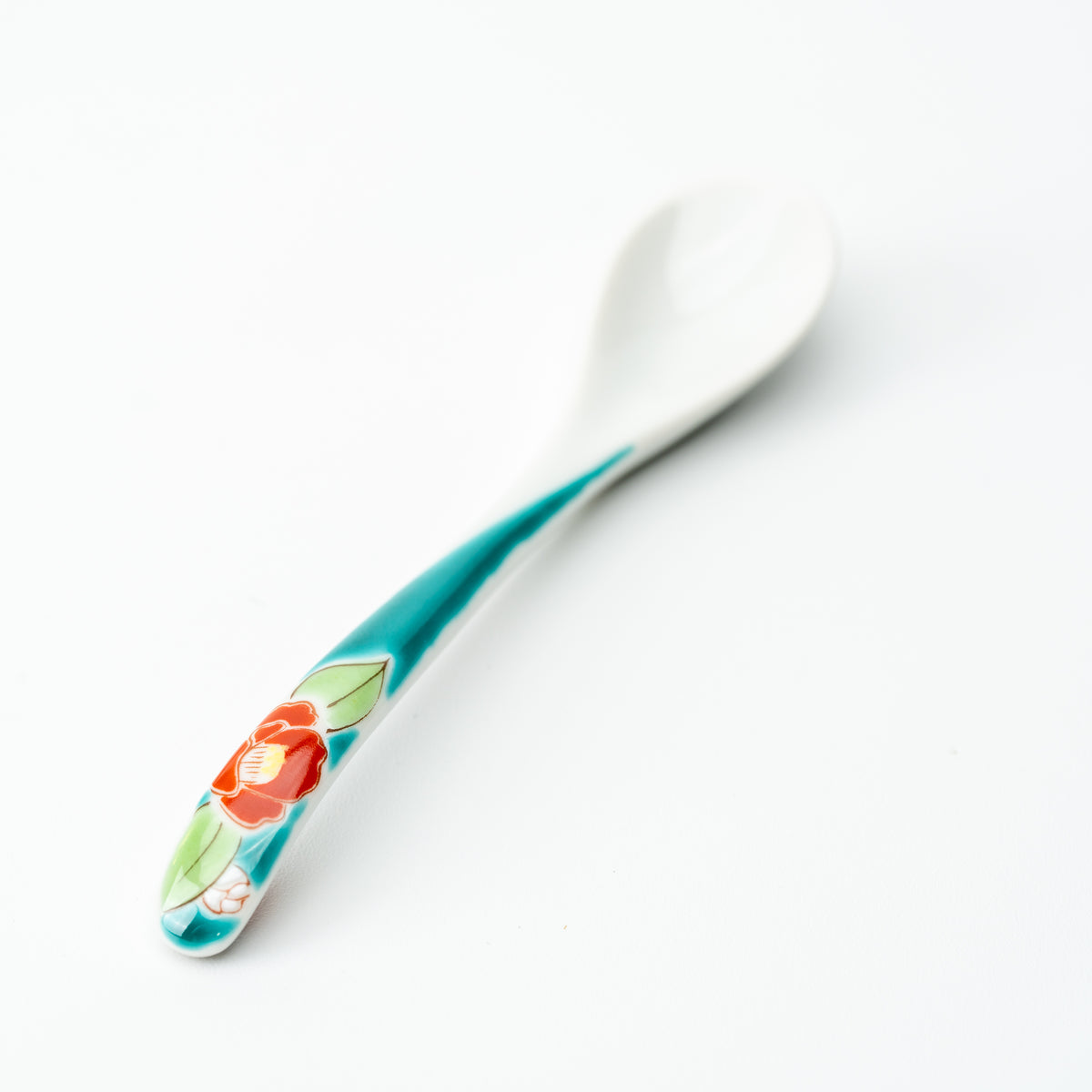 Kutani tea spoon with a red flower and green leaves on a turquoise handle.