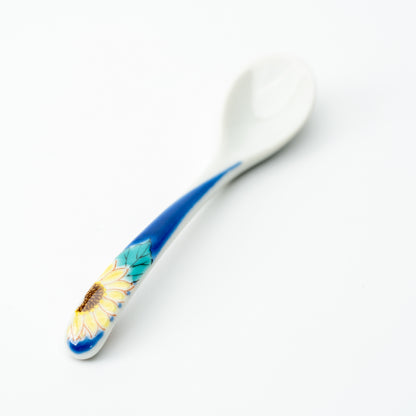 Kutani tea spoon with a yellow sunflower on a blue handle.