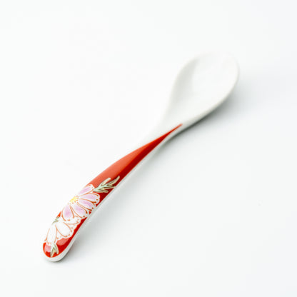 Kutani tea spoon with a pale pink flower on a red handle.