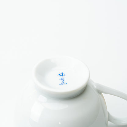 Underside of the Kakiemon-style quail cup with a blue maker's mark inside the foot ring.