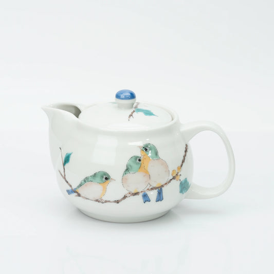 Kutani porcelain teapot in white, three mejiro birds perched on a berry branch in green, yellow and blue, blue bud finial on the lid.