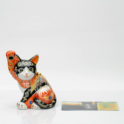 Kutani maneki neko shown with the included Kutani-yaki leaflet