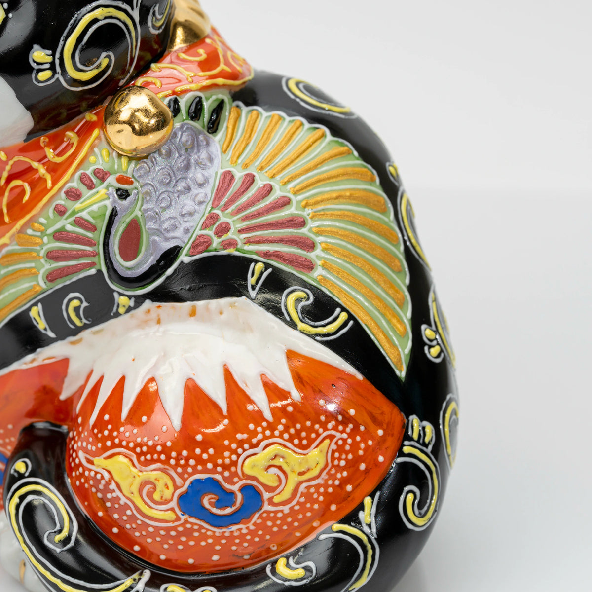 Close-up of the crane motif and snow-capped Red Fuji with raised dekomori details