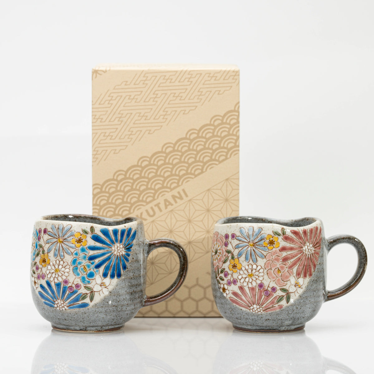 The two Kutani mugs in front of their printed Kutani box