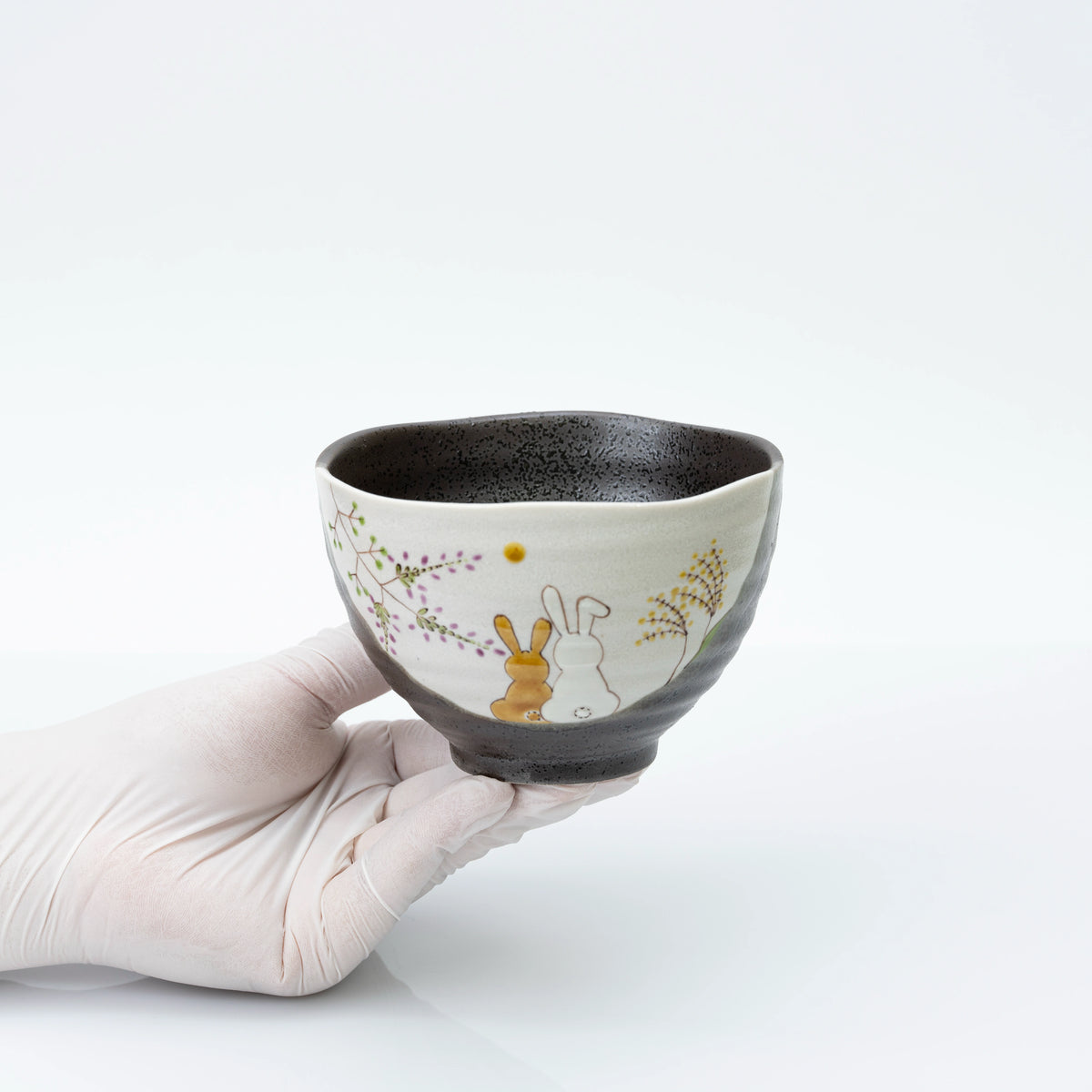 Kutani rice bowl held in one hand for scale, 12 cm across