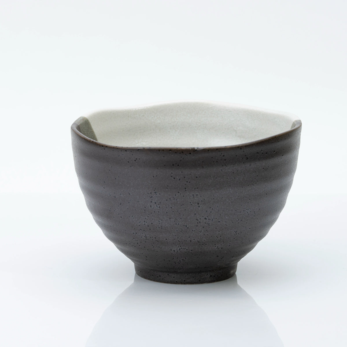 Back of the bowl in dark speckled glaze