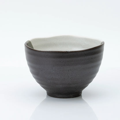 Back of the bowl in dark speckled glaze