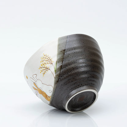 Tilted view of the bowl showing the exterior and the foot ring