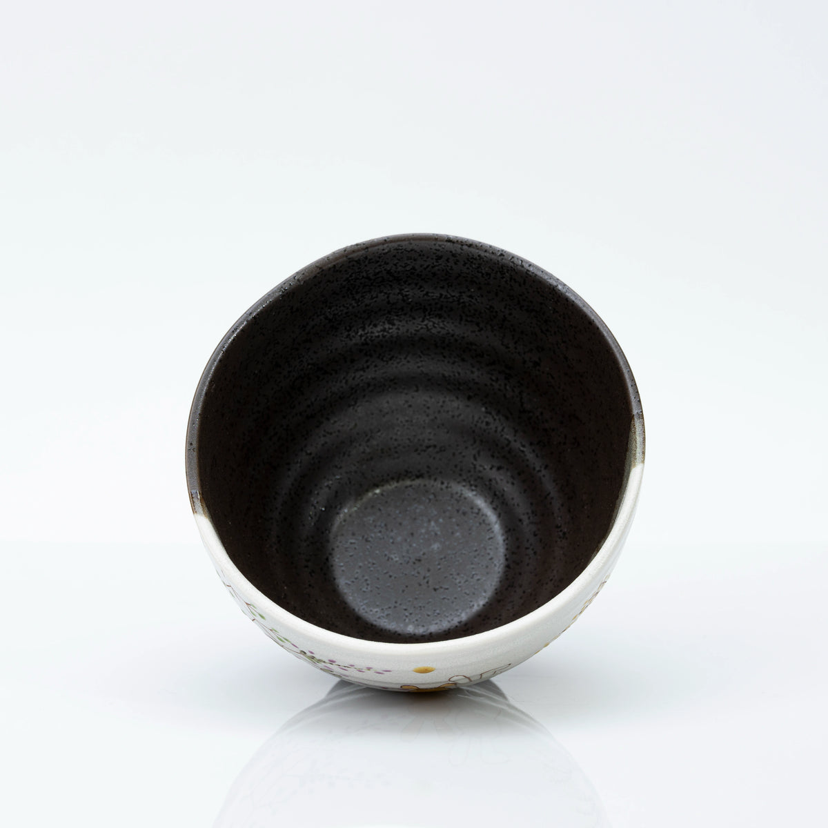View straight into the bowl showing the dark speckled interior