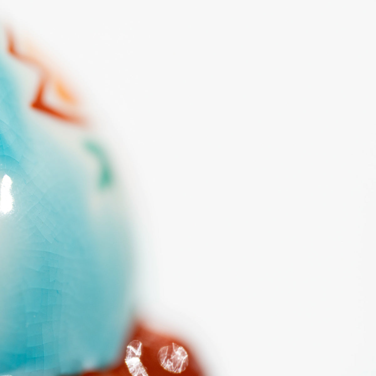 Macro view of the fine crackle pattern in the turquoise blue glaze