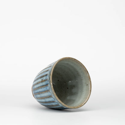 Ribbed blue-grey tea cup, view from above showing the opening and interior.