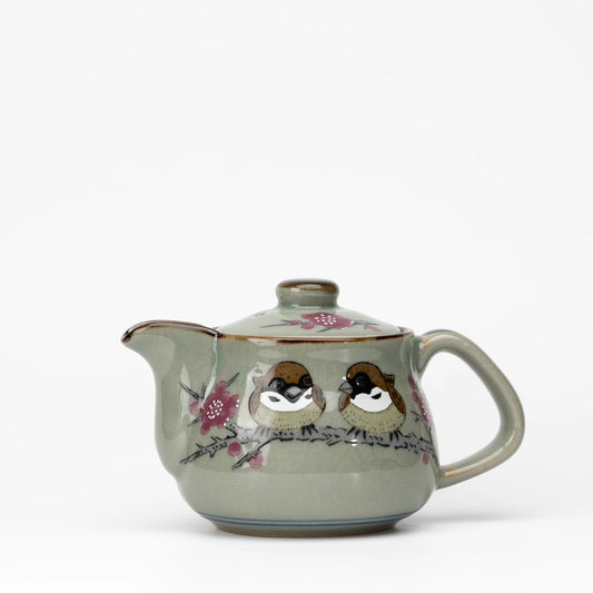 Sparrow teapot, whole view on a neutral background.