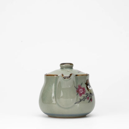 Sparrow teapot, side view showing the shape and surface.