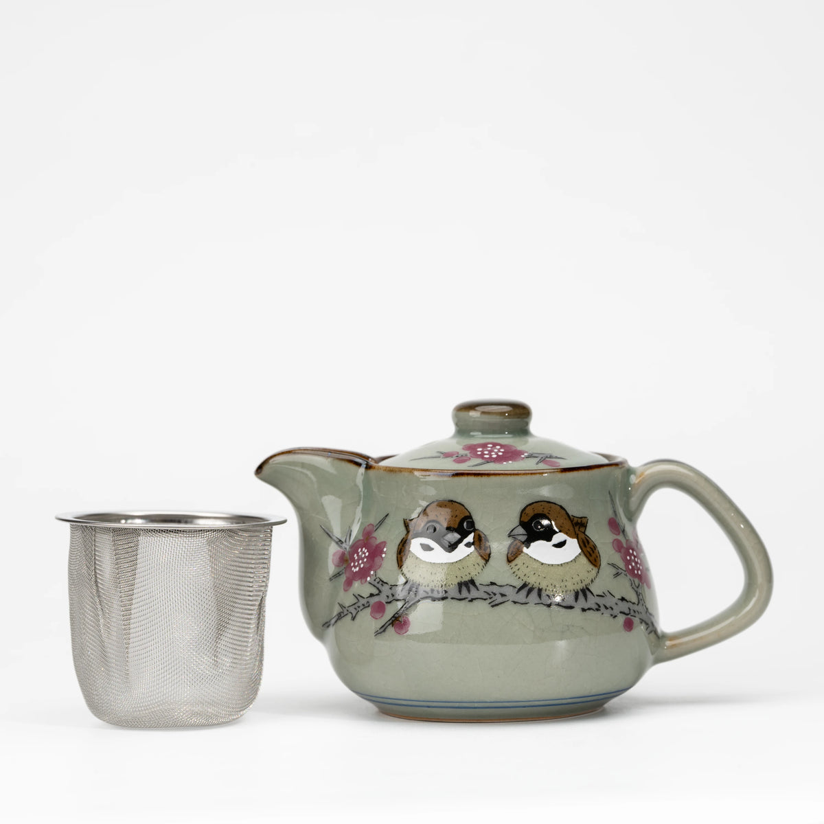 Sparrow teapot, teapot with the removable mesh strainer beside it.