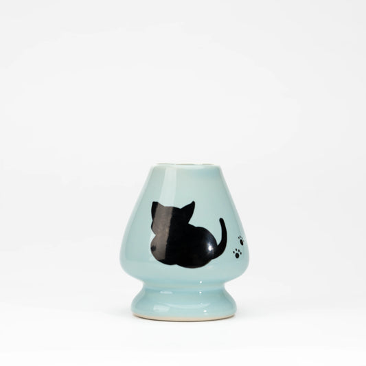 Pale blue cat whisk holder, whole view on a neutral background.