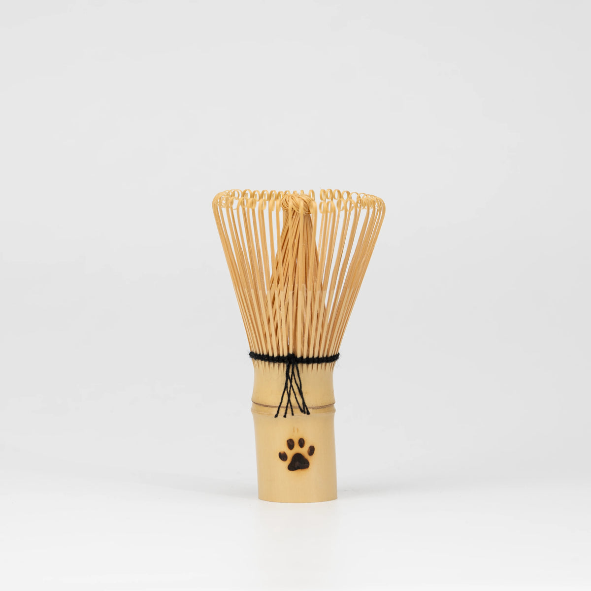 Paw-print bamboo mini whisk, whole view on a neutral background.